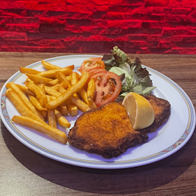 Putenschnitzel mit Pommes
