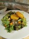 Pankómorzsában sült kecskesajt, friss salátán gránátalmával, citrusos dresszinggel, ropogós tökmaggal